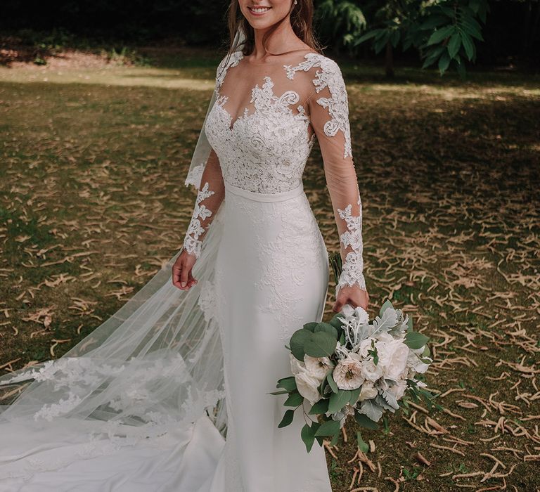 Bride in Lace Pronovias Bridal Gown | White and Silver English Country Garden At Home Marquee Wedding | Jason Mark Harris Photography