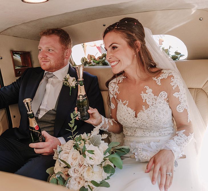 Bride in Lace Pronovias Bridal Gown | Groom in Thom Sweeney Suit | White and Silver English Country Garden At Home Marquee Wedding | Jason Mark Harris Photography