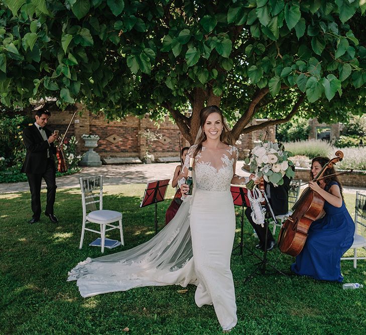 Bride in Lace Pronovias Wedding Dress | White and Silver English Country Garden At Home Marquee Wedding | Jason Mark Harris Photography