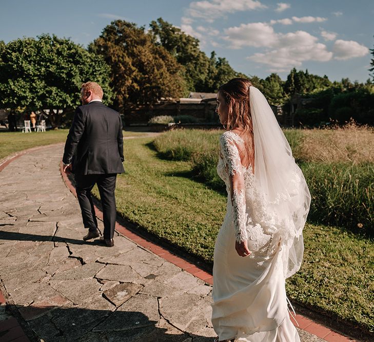 Bride in Lace Pronovias Bridal Gown | Groom in Thom Sweeney Suit | White and Silver English Country Garden At Home Marquee Wedding | Jason Mark Harris Photography