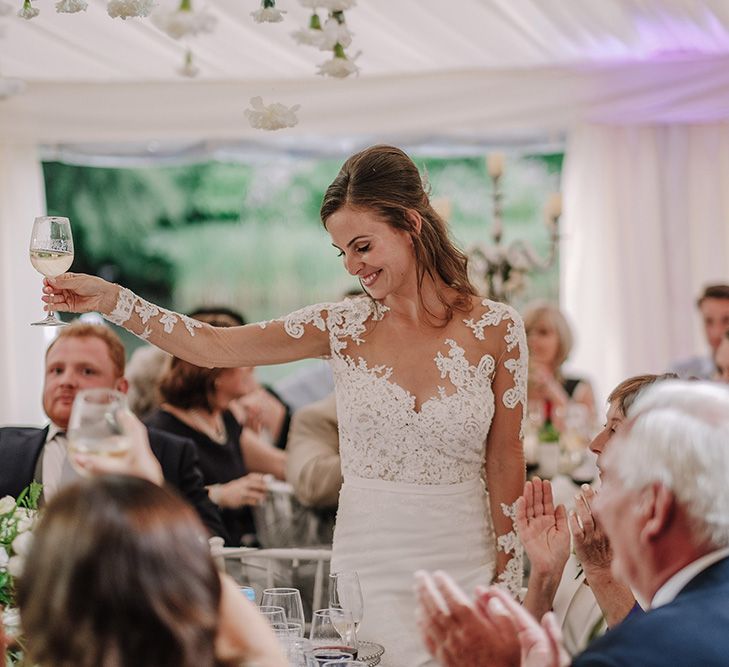 Bride in Lace Pronovias Bridal Gown | White and Silver English Country Garden At Home Marquee Wedding | Jason Mark Harris Photography