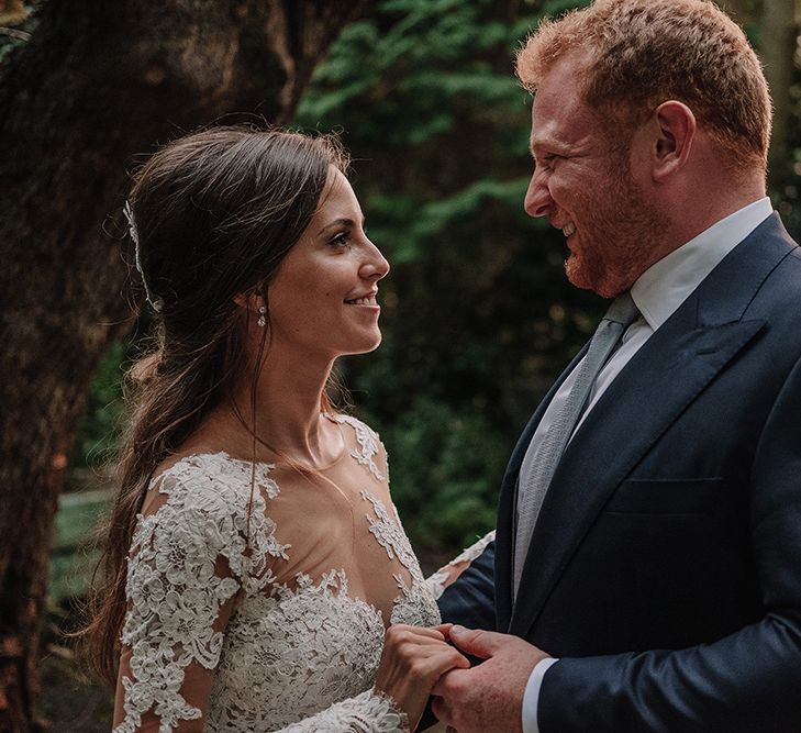 Bride in Lace Pronovias Bridal Gown | Groom in Thom Sweeney Suit | White and Silver English Country Garden At Home Marquee Wedding | Jason Mark Harris Photography