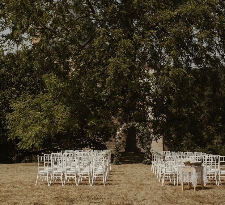 Outdoor Wedding Ceremony with Floral Arch | Destination Wedding at Château de Saint Martory in France Planned by Senses Events | Danelle Bohane Photography | Matthias Guerin Films