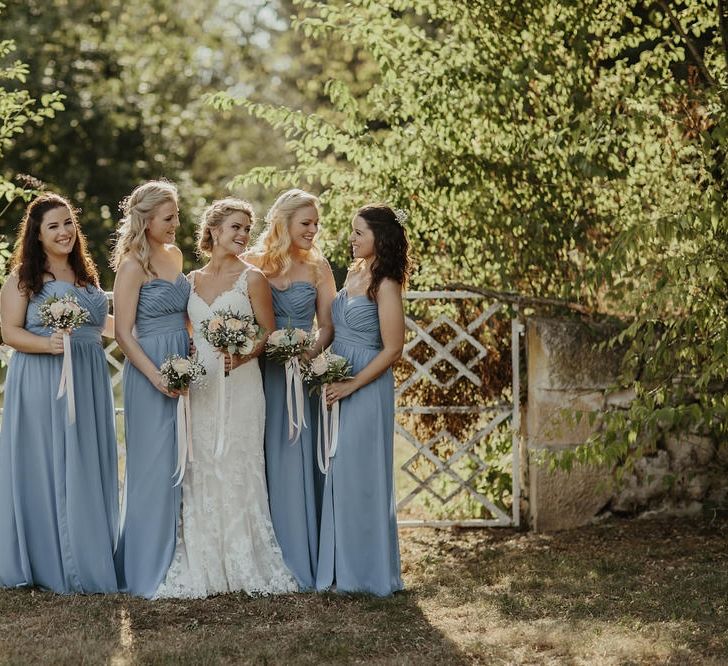 Bride in Stella York Gown | Bridesmaids in Blue Dessy Dresses | Outdoor Destination Wedding at Château de Saint Martory in France Planned by Senses Events | Danelle Bohane Photography | Matthias Guerin Films