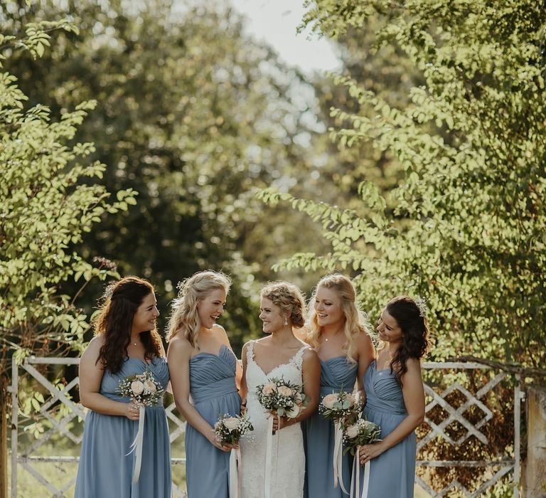 Bride in Stella York Gown | Bridesmaids in Blue Dessy Dresses | Outdoor Destination Wedding at Château de Saint Martory in France Planned by Senses Events | Danelle Bohane Photography | Matthias Guerin Films