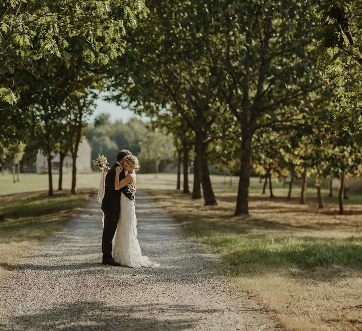 Bride in Lace Stella York Dress | Groom in Black Tie | Outdoor Destination Wedding at Château de Saint Martory in France Planned by Senses Events | Danelle Bohane Photography | Matthias Guerin Films