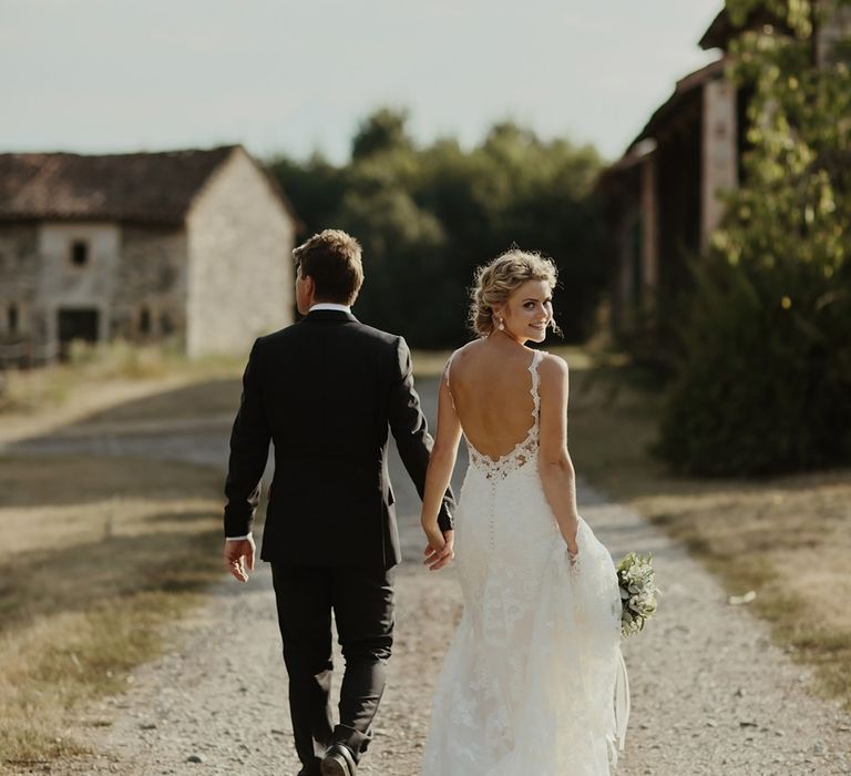 Bride in Lace Stella York Dress | Groom in Black Tie | Outdoor Destination Wedding at Château de Saint Martory in France Planned by Senses Events | Danelle Bohane Photography | Matthias Guerin Films