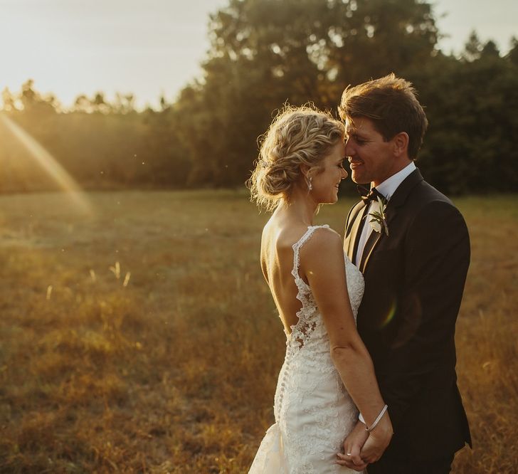 Golden Hour | Bride in Lace Stella York Dress | Groom in Black Tie | Outdoor Destination Wedding at Château de Saint Martory in France Planned by Senses Events | Danelle Bohane Photography | Matthias Guerin Films