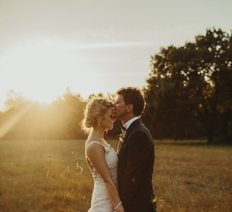 Golden Hour | Bride in Lace Stella York Dress | Groom in Black Tie | Outdoor Destination Wedding at Château de Saint Martory in France Planned by Senses Events | Danelle Bohane Photography | Matthias Guerin Films