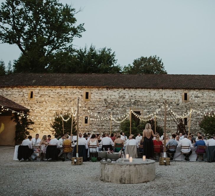 Al Fresco Reception with Festoon Lights | Outdoor Destination Wedding at Château de Saint Martory in France Planned by Senses Events | Danelle Bohane Photography | Matthias Guerin Films