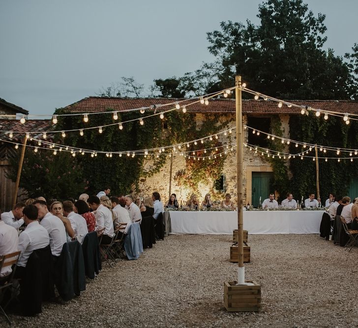 Al Fresco Reception with Festoon Lights | Outdoor Destination Wedding at Château de Saint Martory in France Planned by Senses Events | Danelle Bohane Photography | Matthias Guerin Films