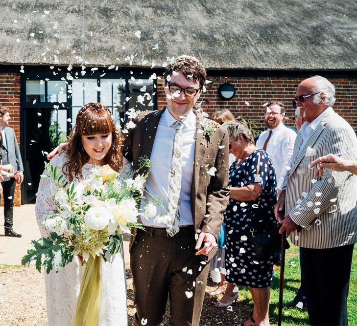 Confetti Exit | Bride in Lucy Can't Dance Jungle Fever Bridal Gown | Groom in Brown Next Suit | Bohemian Wedding at Woodfarm Barn, Suffolk | The Steed Photography