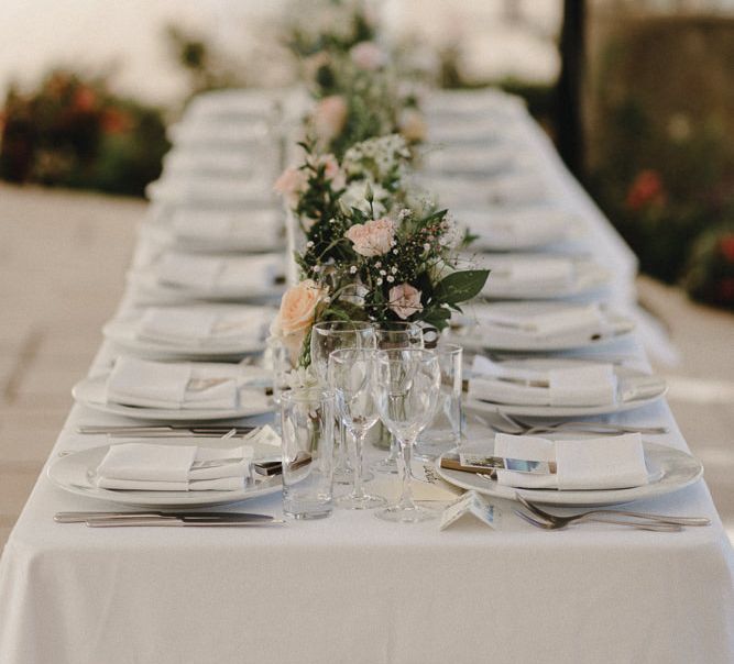 Wedding Table Scape With Cream Linen And Pink Jam Jar Flowers