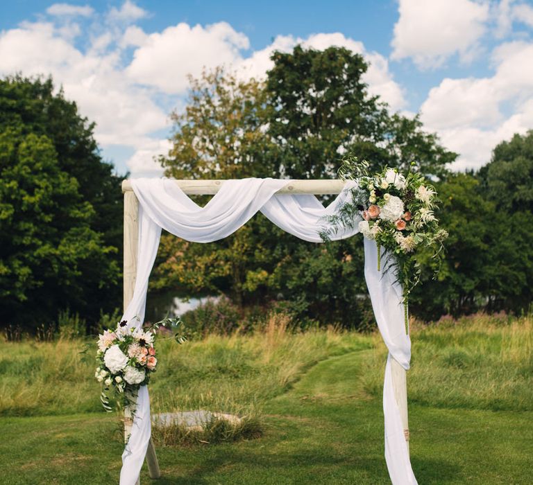 Draped Wedding Altar with Peach Flowers