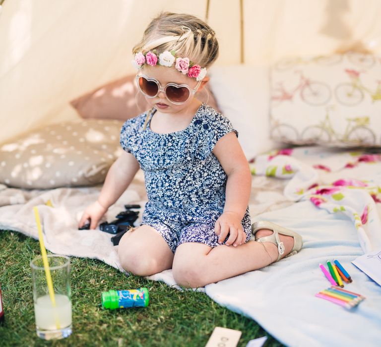 Cute Toddler with Heart Sunglasses & Flower in her Hair