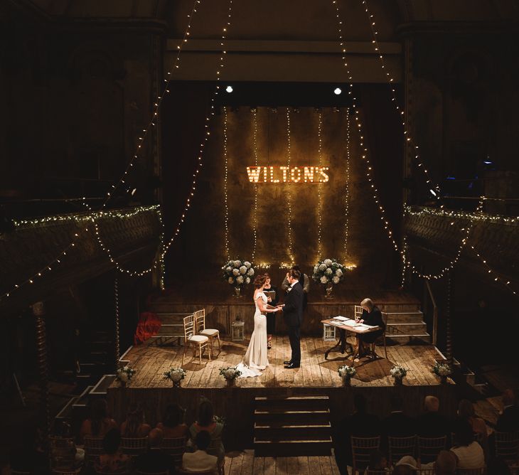 Wiltons Music Hall Wedding With Bride In Paloma Blanca And Bridesmaids In Sequinned Adrianna Papell Gowns Images By Jackson & Co Photography