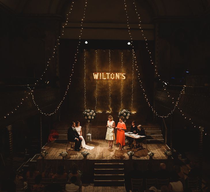 Wiltons Music Hall Wedding With Bride In Paloma Blanca And Bridesmaids In Sequinned Adrianna Papell Gowns Images By Jackson & Co Photography