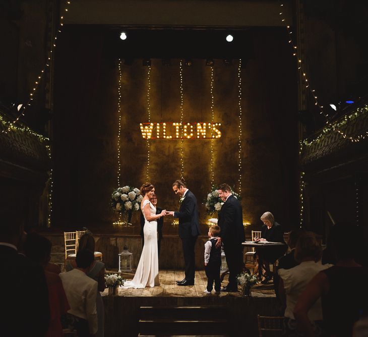 Wiltons Music Hall Wedding With Bride In Paloma Blanca And Bridesmaids In Sequinned Adrianna Papell Gowns Images By Jackson & Co Photography