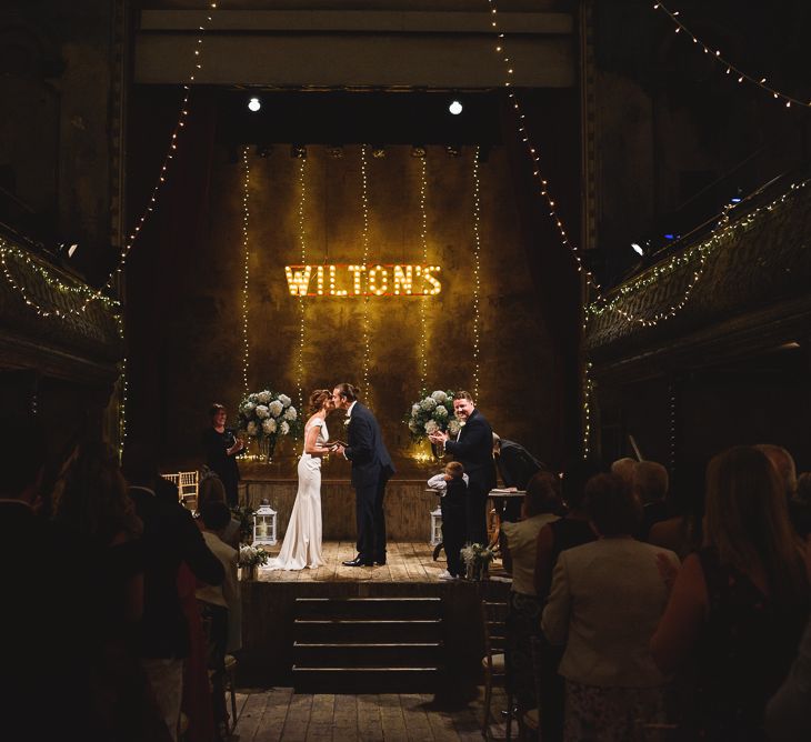 Wiltons Music Hall Wedding With Bride In Paloma Blanca And Bridesmaids In Sequinned Adrianna Papell Gowns Images By Jackson & Co Photography