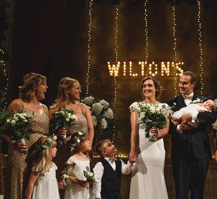 Wiltons Music Hall Wedding With Bride In Paloma Blanca And Bridesmaids In Sequinned Adrianna Papell Gowns Images By Jackson & Co Photography