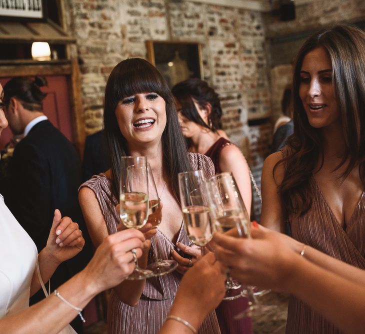 Wiltons Music Hall Wedding With Bride In Paloma Blanca And Bridesmaids In Sequinned Adrianna Papell Gowns Images By Jackson & Co Photography