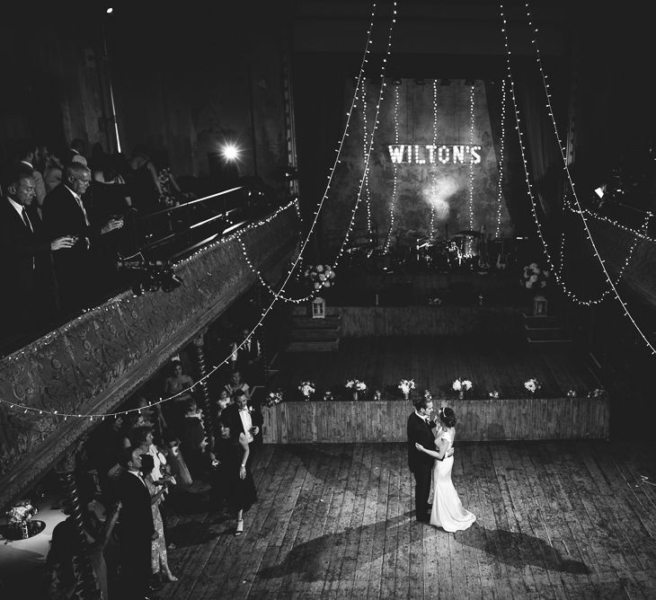 Wiltons Music Hall Wedding With Bride In Paloma Blanca And Bridesmaids In Sequinned Adrianna Papell Gowns Images By Jackson & Co Photography