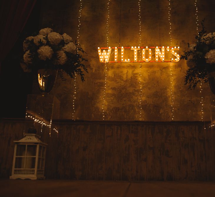 Wiltons Music Hall Wedding With Bride In Paloma Blanca And Bridesmaids In Sequinned Adrianna Papell Gowns Images By Jackson & Co Photography