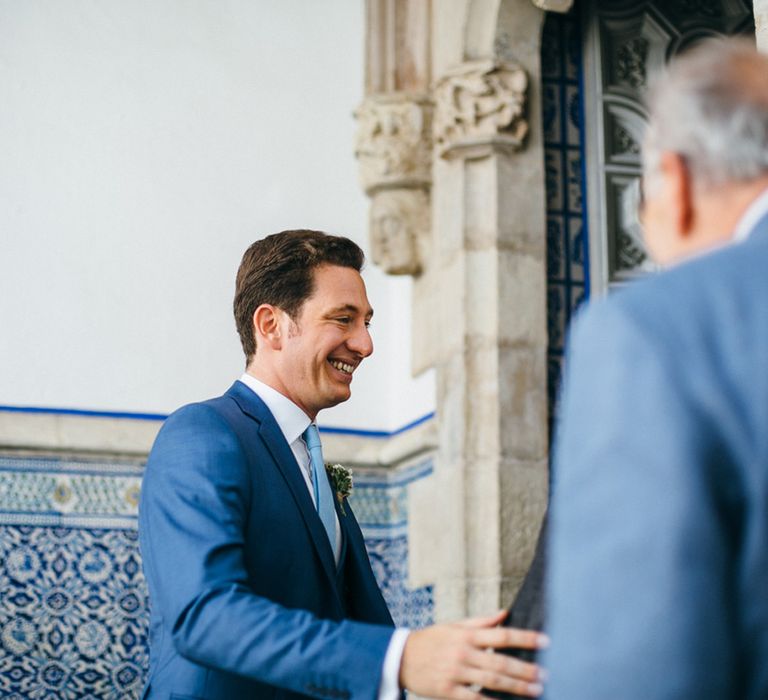 Groom Greeting Guests