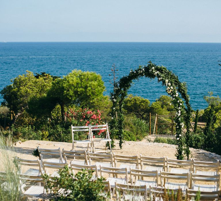 Outdoor Wedding Ceremony with Floral Arch at Casa del Mar Spanish Villa