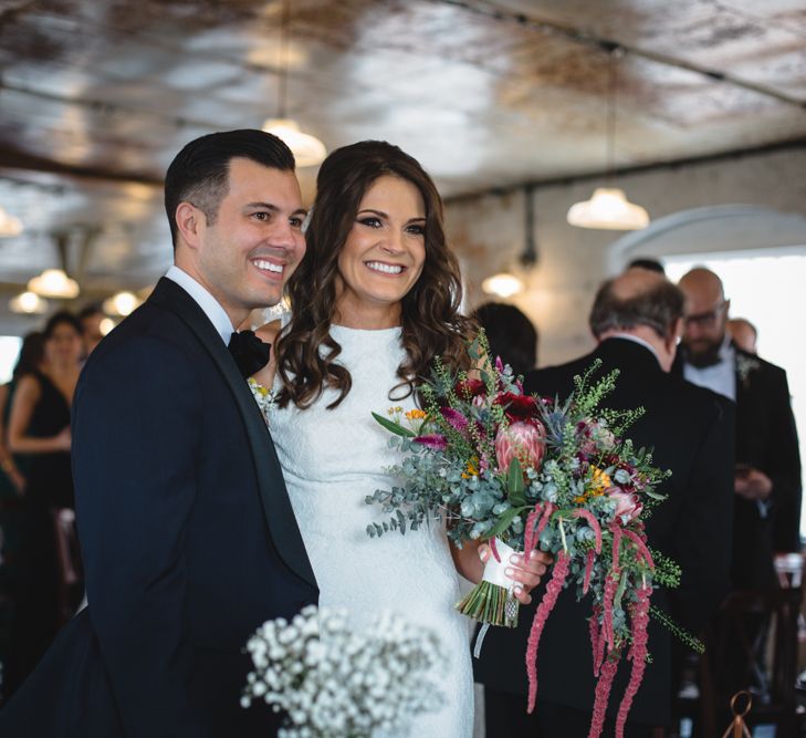 Bride in Pronovias Ornani Bridal Gown & Veil | Groom in Charles Tyrwitt Midnight Blue Tuxedo | Industrial Wedding at The West Mill Venue | Sarah Gray Photography