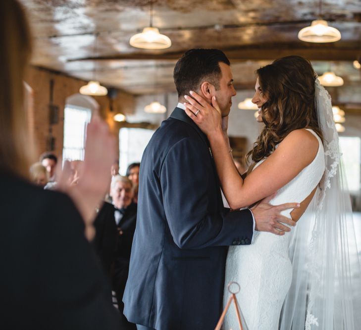 Bride in Pronovias Ornani Bridal Gown & Veil | Groom in Charles Tyrwitt Midnight Blue Tuxedo | Industrial Wedding at The West Mill Venue | Sarah Gray Photography