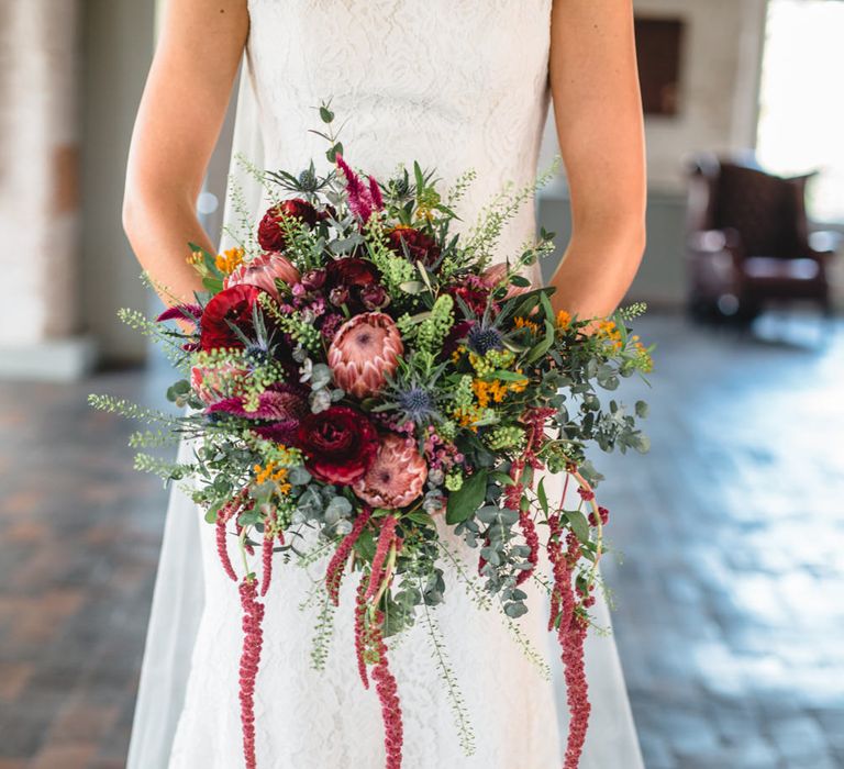 Deep Red, Pink & Greenery Protea Bouquet | Industrial Wedding at The West Mill Venue | Sarah Gray Photography