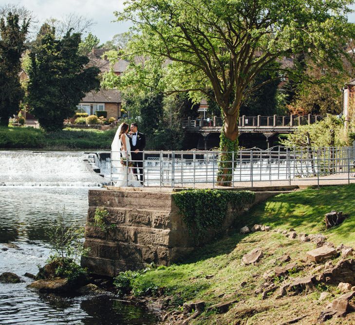 Bride in Pronovias Ornani Bridal Gown & Veil | Groom in Charles Tyrwitt Midnight Blue Tuxedo | Industrial Wedding at The West Mill Venue | Sarah Gray Photography