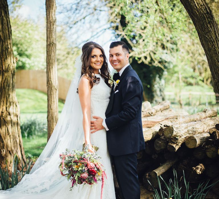 Bride in Pronovias Ornani Bridal Gown & Veil | Groom in Charles Tyrwitt Midnight Blue Tuxedo | Industrial Wedding at The West Mill Venue | Sarah Gray Photography