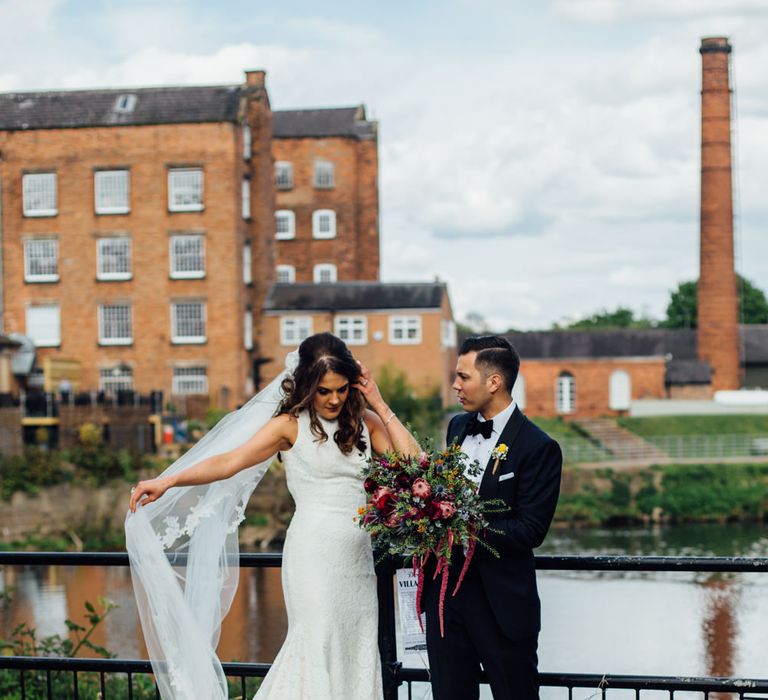 Bride in Pronovias Ornani Bridal Gown & Veil | Groom in Charles Tyrwitt Midnight Blue Tuxedo | Industrial Wedding at The West Mill Venue | Sarah Gray Photography