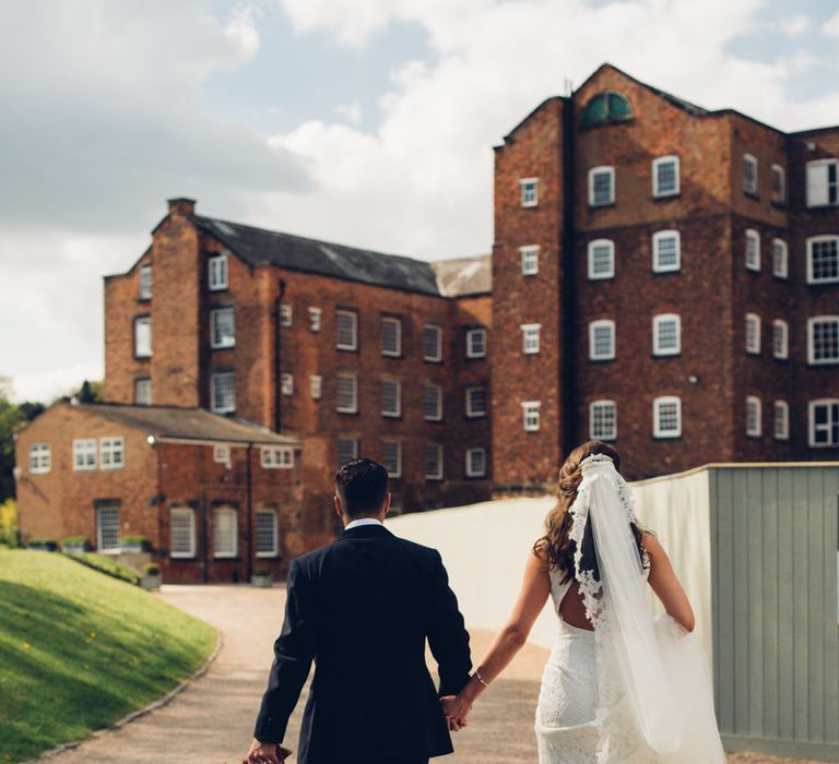 Bride in Pronovias Ornani Bridal Gown & Veil | Groom in Charles Tyrwitt Midnight Blue Tuxedo | Industrial Wedding at The West Mill Venue | Sarah Gray Photography