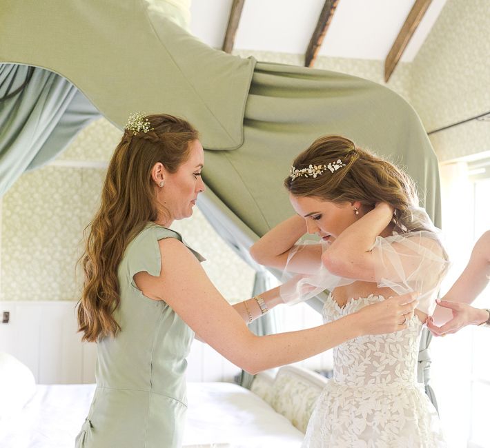 Bridal Preparations | Bride in Mira Zwillinger Bridal Gown | Pale Green Ghost Bridesmaid Dresses | Rustic Soho Farmhouse Ceremony with PapaKata Sperry Tent Greenery filled Reception | Marianne Taylor Photography | Will Warr Films