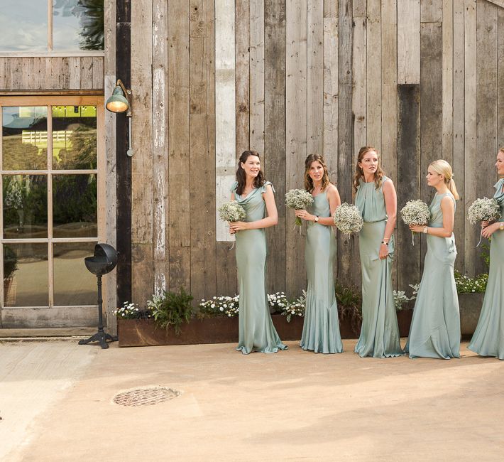 Bride in Mira Zwillinger Bridal Gown | Pale Green Ghost Bridesmaid Dresses | Rustic Soho Farmhouse Ceremony with PapaKata Sperry Tent Greenery filled Reception | Marianne Taylor Photography | Will Warr Films