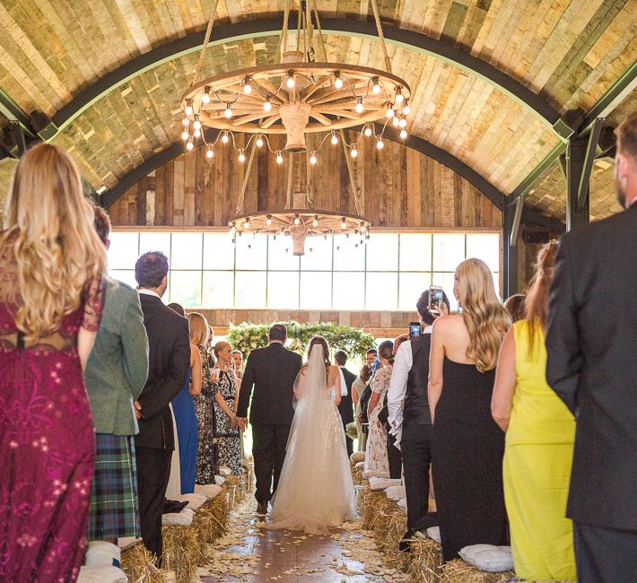 Bride in Mira Zwillinger Bridal Gown | Rustic Soho Farmhouse Ceremony with PapaKata Sperry Tent Greenery filled Reception | Marianne Taylor Photography | Will Warr Films