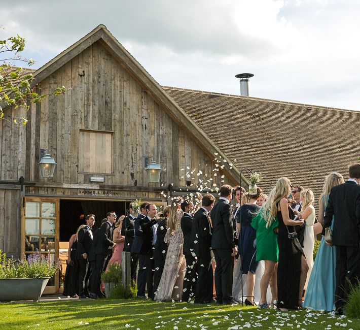 Confetti Moment | Bride in Mira Zwillinger Bridal Gown | Rustic Soho Farmhouse Ceremony with PapaKata Sperry Tent Greenery filled Reception | Marianne Taylor Photography | Will Warr Films