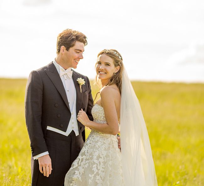 Bride in Mira Zwillinger Bridal Gown | Groom in Black Tie | Rustic Soho Farmhouse Ceremony with PapaKata Sperry Tent Greenery filled Reception | Marianne Taylor Photography | Will Warr Films