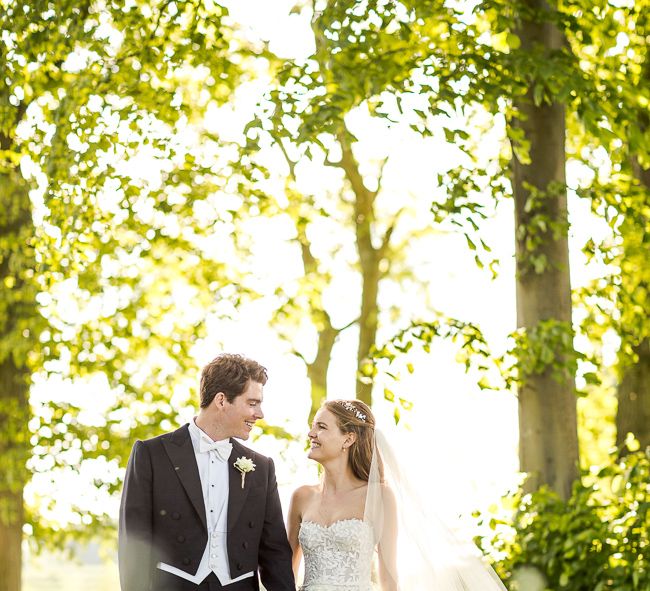 Bride in Mira Zwillinger Bridal Gown | Groom in Black Tie | Rustic Soho Farmhouse Ceremony with PapaKata Sperry Tent Greenery filled Reception | Marianne Taylor Photography | Will Warr Films