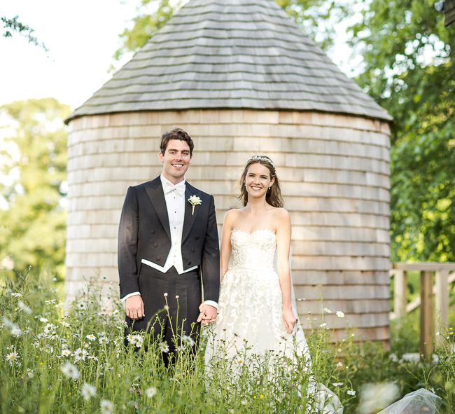 Bride in Mira Zwillinger Bridal Gown | Groom in Black Tie | Rustic Soho Farmhouse Ceremony with PapaKata Sperry Tent Greenery filled Reception | Marianne Taylor Photography | Will Warr Films