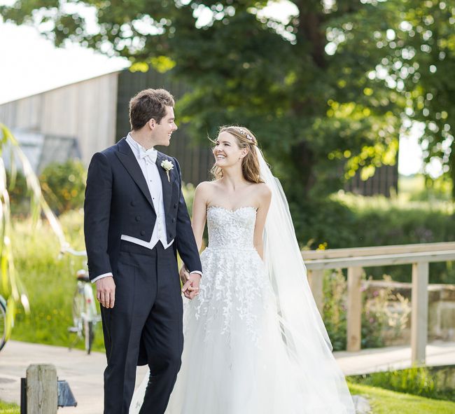 Bride in Mira Zwillinger Bridal Gown | Groom in Black Tie | Rustic Soho Farmhouse Ceremony with PapaKata Sperry Tent Greenery filled Reception | Marianne Taylor Photography | Will Warr Films