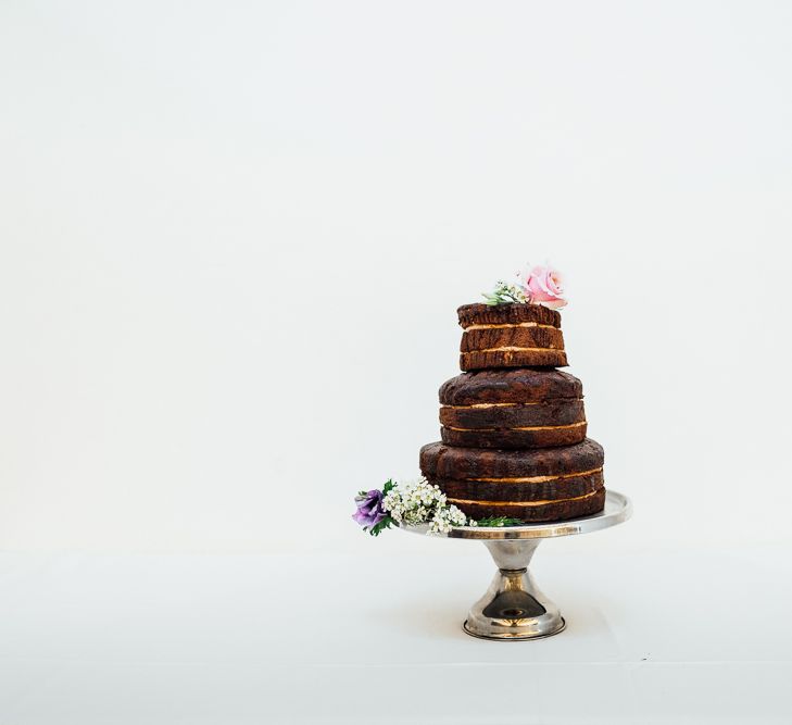 Chocolate Wedding Cake // Vintage Inspired Wedding With 20s & 30s Influences In London At Shoreditch Studios With Images From Beatrici Photography And Styling By The Barnables