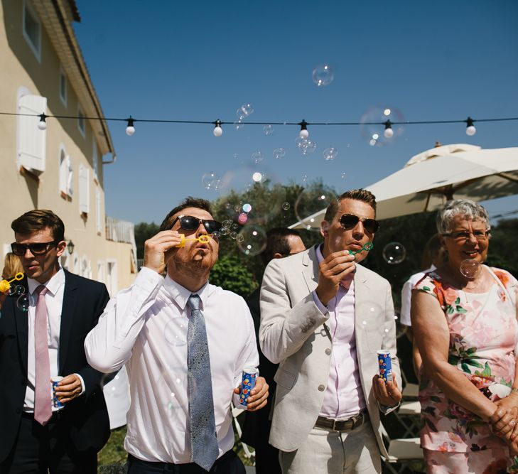 Wedding Guests Blowing Bubbles