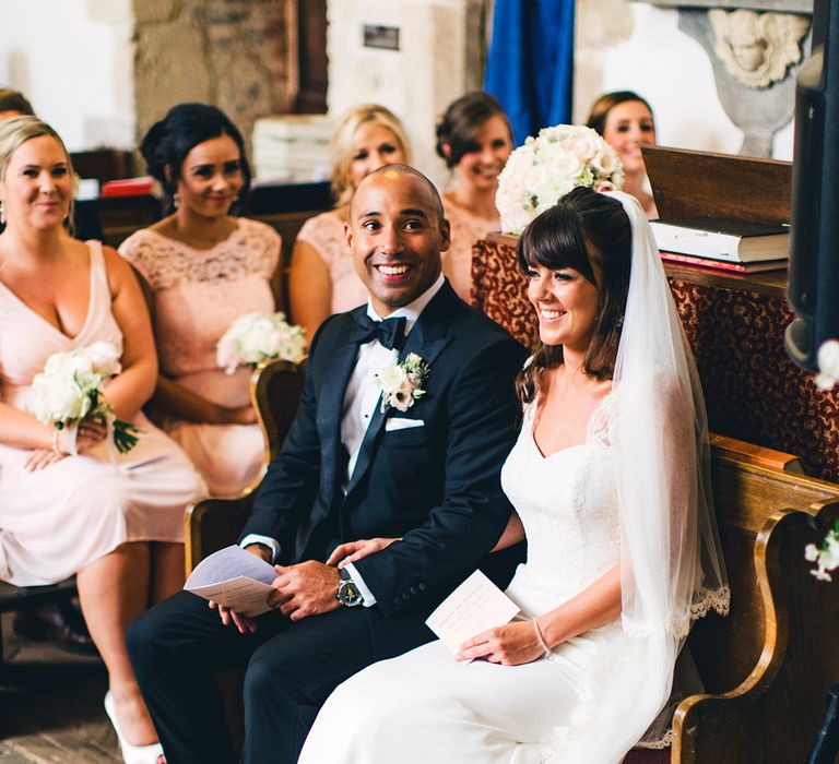 Bride & Groom During Church Ceremony | St Donat's Castle Wedding With Pink & Gold Colour Scheme | Images by Steve Gerrard Photography