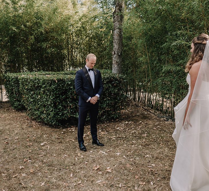 First Look | Bride in Monique Lhuillier Gown | Groom in Tuxedo | Super Luxe Blush, White & Greenery Destination Wedding at Villa Pitiana, Tuscany, Italy | Jason Mark Harris Photography | Angelo La Torre Film