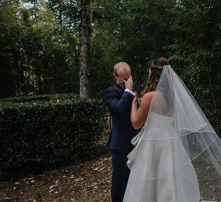 First Look | Bride in Monique Lhuillier Gown | Groom in Tuxedo | Super Luxe Blush, White & Greenery Destination Wedding at Villa Pitiana, Tuscany, Italy | Jason Mark Harris Photography | Angelo La Torre Film