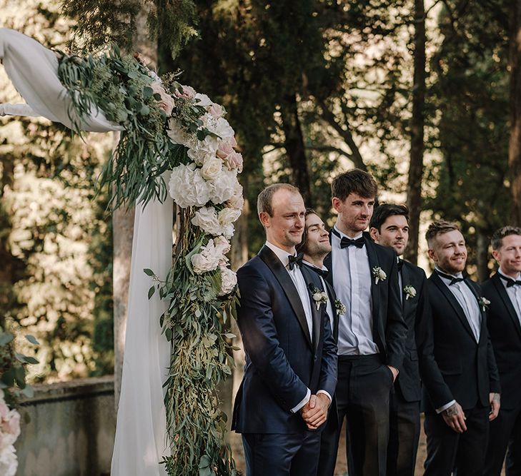 Wedding Ceremony | Groomsmen in Tuxedos | Super Luxe Blush, White & Greenery Destination Wedding at Villa Pitiana, Tuscany, Italy | Jason Mark Harris Photography | Angelo La Torre Film